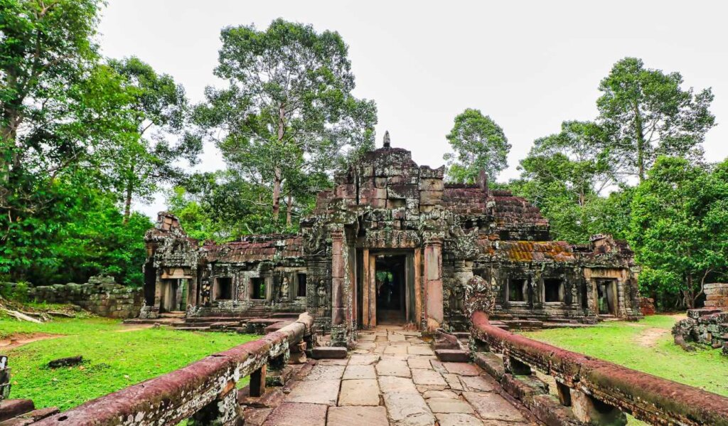 Stone walkway leading up to the ruins of Banteay Kdei, a 13th-century monastic Buddhist temple at Siem Reap, Cambodia, Asia