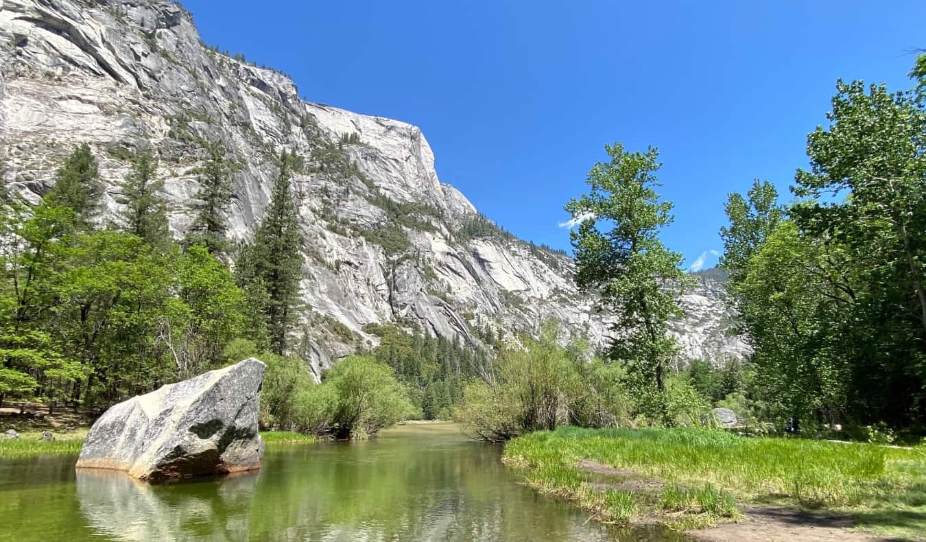A rugged mountain with a streaming running in front in Yosemite National Park, California