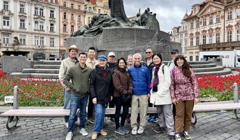 Nomadic Matt and his tour group posing for a photo together in Prague, Czechia