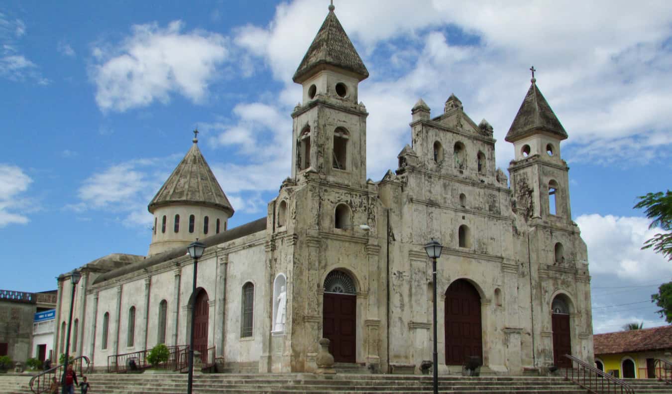 A tall and historic building on a sunny day in Granada, Nicaragua
