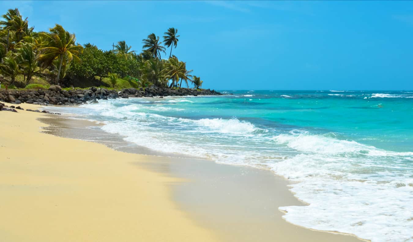 relaxing on the corn islands in Nicaragua with a wide, empty beach stretching out along the coast